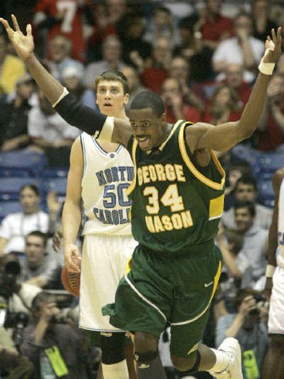 
Will Thomas celebrates near the end of George Mason's victory over North Carolina in the NCAA tournament. 
 (Associated Press / The Spokesman-Review)