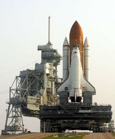
The space shuttle Atlantis ends an almost seven-hour journey from the vehicle assembly building to launch pad 39b at the Kennedy Space Center at Cape Canaveral, Fla., on Wednesday.
 (Associated Press / The Spokesman-Review)
