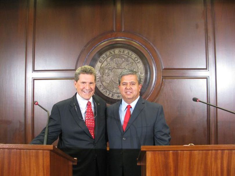 Stan OIson, left, and Tom Luna, right, pose for a photo together before their debate Tuesday night on Idaho Public Television. (Kevin Rank / Idaho Public Television)