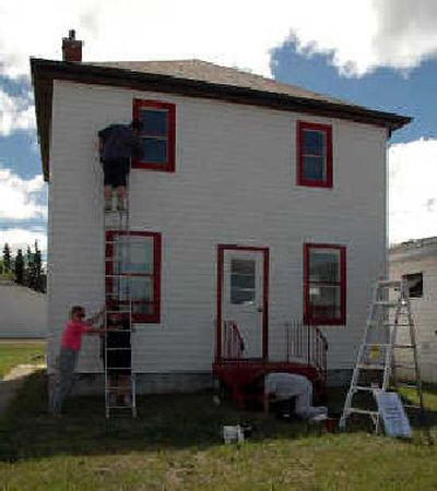 
People work on the house that Kyle MacDonald bartered for in Kipling, Saskatchewan, Canada. 
 (Associated Press / The Spokesman-Review)