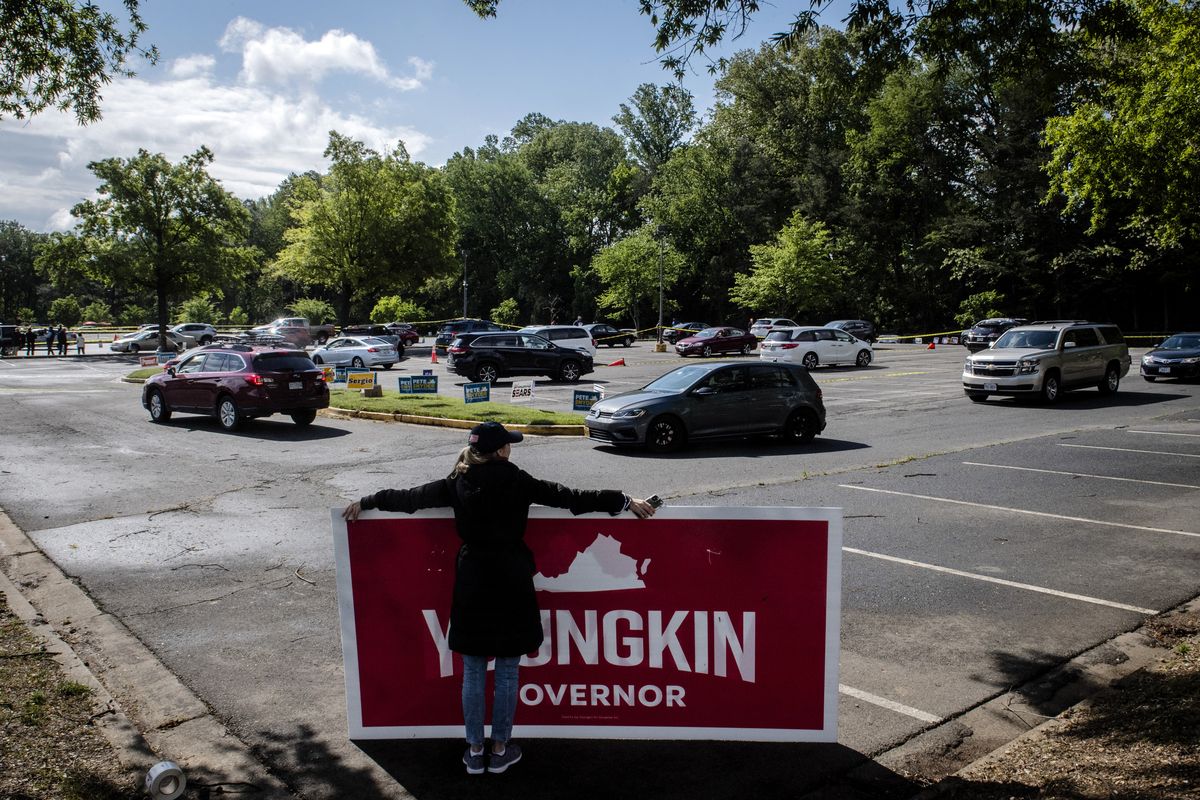 Cars snake through the parking lot of NOVA Community College as the Virginia GOP holds a drive-thru primary to select candidates for the 2021 general election, Saturday, May 8, 2021, in Annandale, Va.  (Bill O'Leary)