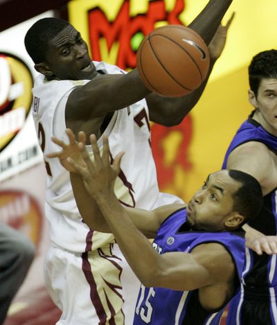 FSU’s Solomon Alabi, top, and Duke’s Gerald Henderson vie for rebound. (Associated Press / The Spokesman-Review)