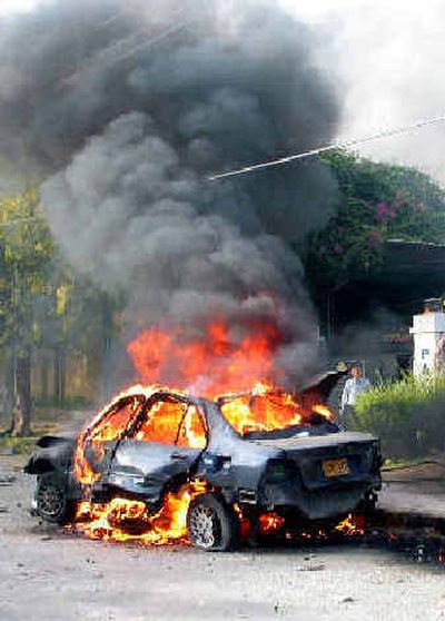 
A car burns after a second explosion outside the Pakistan-American cultural center, in Karachi, Pakistan, on Wednesday. Two cars exploded minutes apart from each other, according to police and witnesses. A car burns after a second explosion outside the Pakistan-American cultural center, in Karachi, Pakistan, on Wednesday. Two cars exploded minutes apart from each other, according to police and witnesses. 
 (Associated PressAssociated Press / The Spokesman-Review)