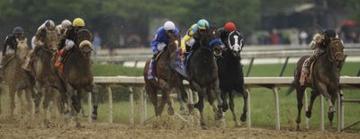 Calvin Borel squeezes Mine That Bird into the lead along the rail en route to Kentucky Derby victory. (Associated Press / The Spokesman-Review)