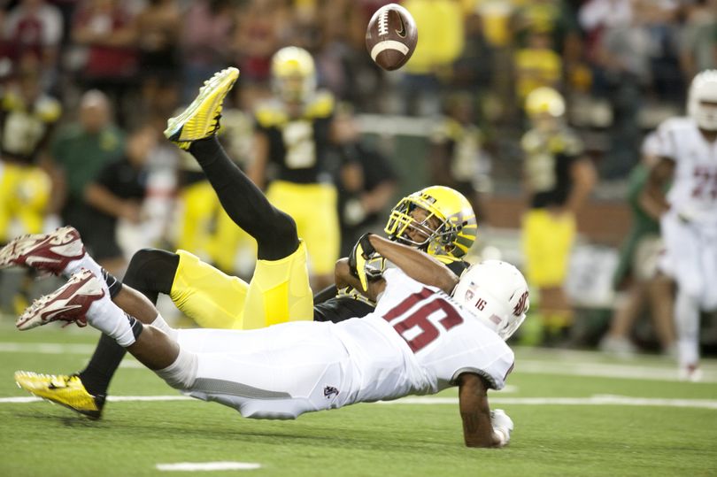 WSU cornerback Charleston White (16) breaks up a pass intended for Oregon receiver Dwayne Stanford (88) during the first half of a PAC 12 college football game on Saturday, Sep 20, 2014 at Martin Stadium in Pullman, Wash. (Tyler Tjomsland / The Spokesman-Review)