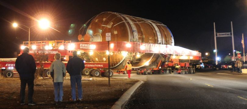 Despite the freezing weather people gather to watch as the first of four Conoco Phillips megaloads maneuvers its way onto the frontage road along U.S. Highway 12 Tuesday night, Feb. 1, 2011 in Lewiston, Idaho. The cargo along with the two trucks and trailer hauling it weigh almost 300 tons. (AP/Lewiston Tribune / Kyle Mills)