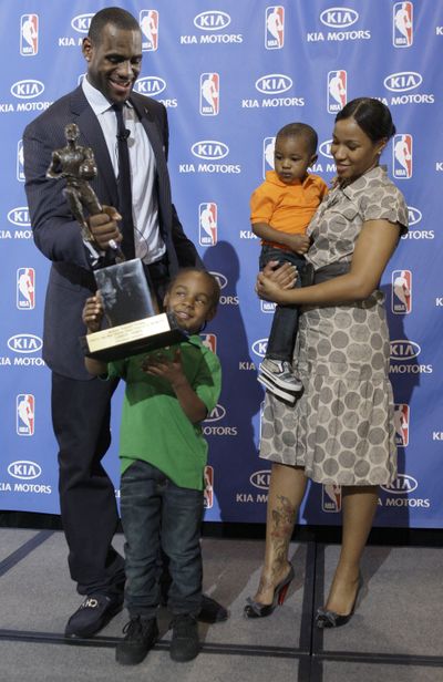 Cavaliers LeBron James hands the MVP trophy to his son Lebron Jr., 4. (Associated Press / The Spokesman-Review)