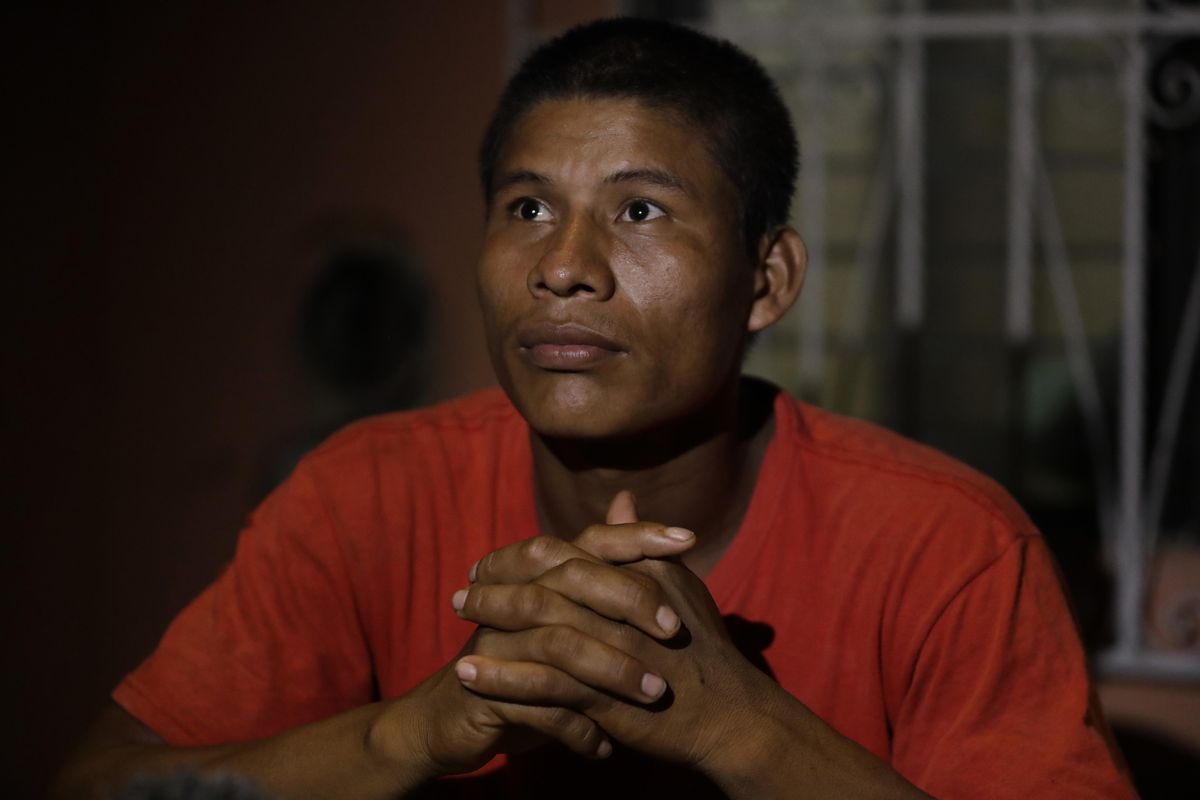 Honduran migrant Carlos Mejia sits outside the small house where his family  is renting a room on Dec. 6, 2016, in Tenosique, Tabasco state, Mexico. (Rebecca Blackwell / Associated Press)