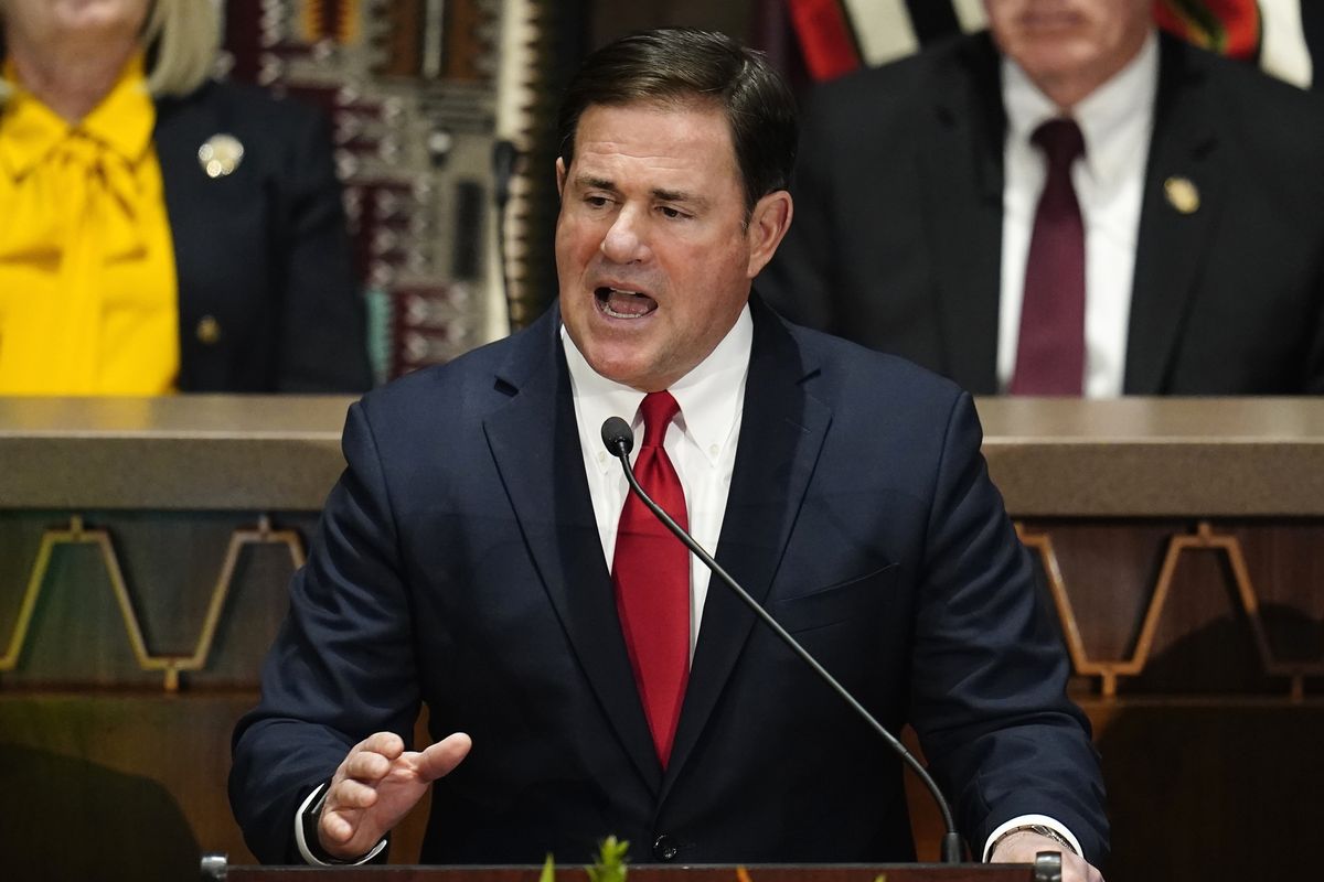 In this Jan. 10, 2022, photo, Arizona Republican Gov. Doug Ducey gives his state of the state address at the Arizona Capitol, in Phoenix. Former President Donald Trump is stepping up his election-year effort to dominate the Republican Party with a Saturday rally in Arizona in which he plans to castigate anyone who dares to question his lie that the 2020 presidential election was stolen, likely including Ducey.  (Ross D. Franklin)