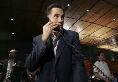 
Mitt Romney makes a phone call at a fundraiser in Boston on Wednesday. 
 (Associated Press / The Spokesman-Review)