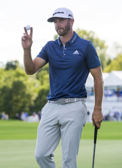 Dustin Johnson reacts to winning the BMW Championship. (Doug McSchooler / Associated Press)