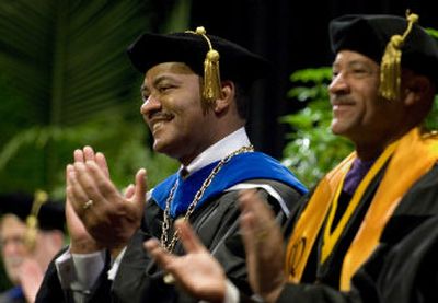 
University of Missouri system President Elson Floyd, left, attends a commencement honors convocation Saturday in Columbia. 
 (Colin Mulvany / The Spokesman-Review)