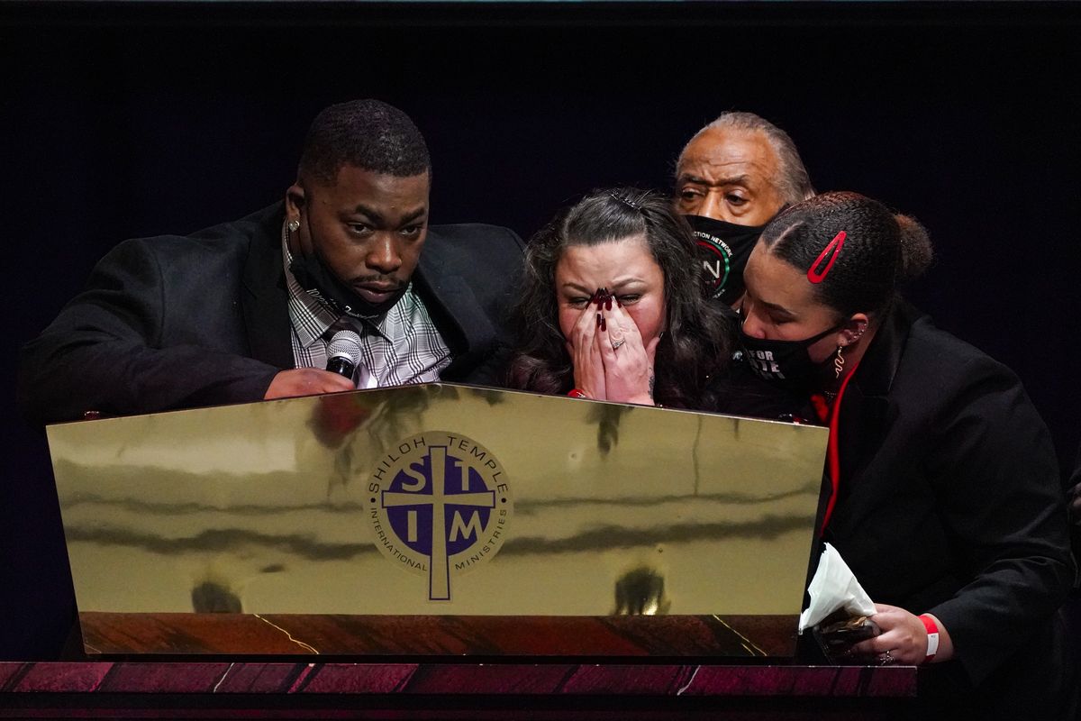 Katie and Arbuey Wright, Daunte Wright’s parents, cry as they speak Thursday during funeral services at Shiloh Temple International Ministries in Minneapolis.  (Julio Cortez)