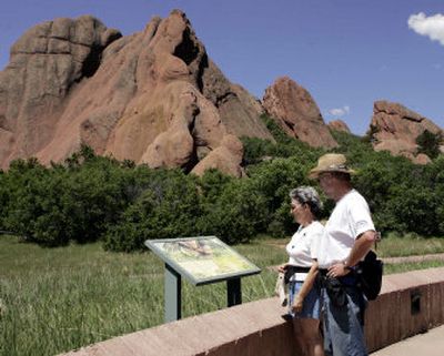 
Littleton, Colo., residents Phil and Marilyn Scott study one of the information signs at Roxborough State Park near Denver. The park is about 40 minutes south of Denver, and offers easy to moderate trails that wind through towering red rock spires.
 (Associated Press / The Spokesman-Review)