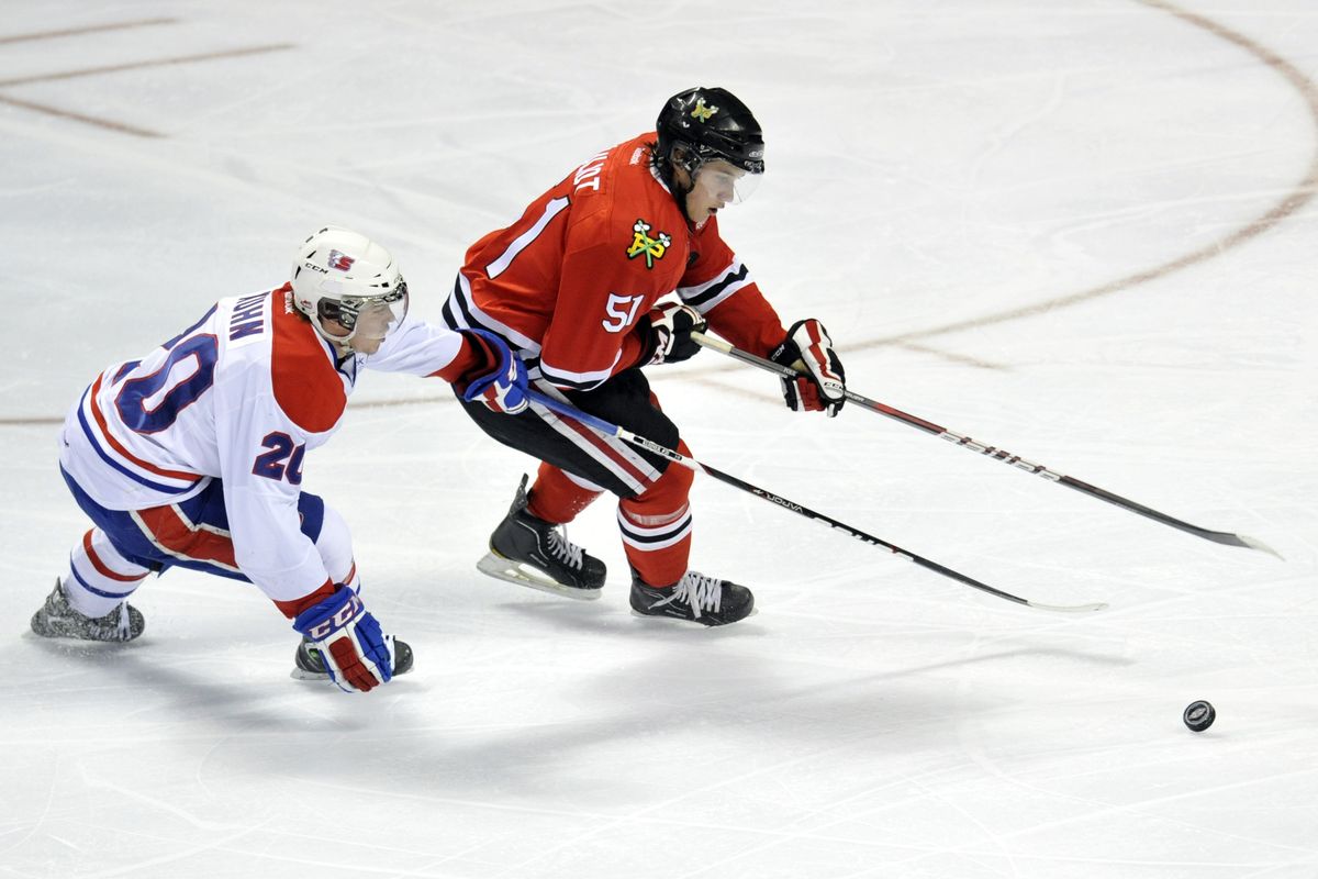 Spokane Chiefs Steven Kuhn (20) and Portland