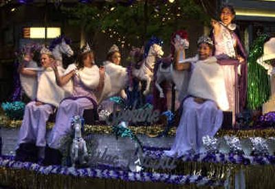 Lilac Princesses, from left to right, Lindsey Cressey, Nicole Holland, Rachael Roig and Courtney Millan and Lilac Queen Jamie Pacello wave during the Lilac Parade.
 (Holly Pickett / The Spokesman-Review)