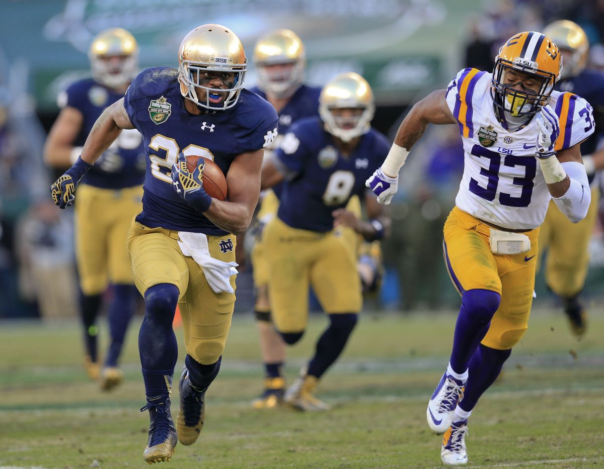 Notre Dame wide receiver C.J. Prosise dashes past LSU safety Jamal Adams on his way to a 50-yard touchdown on Tuesday. (Associated Press)