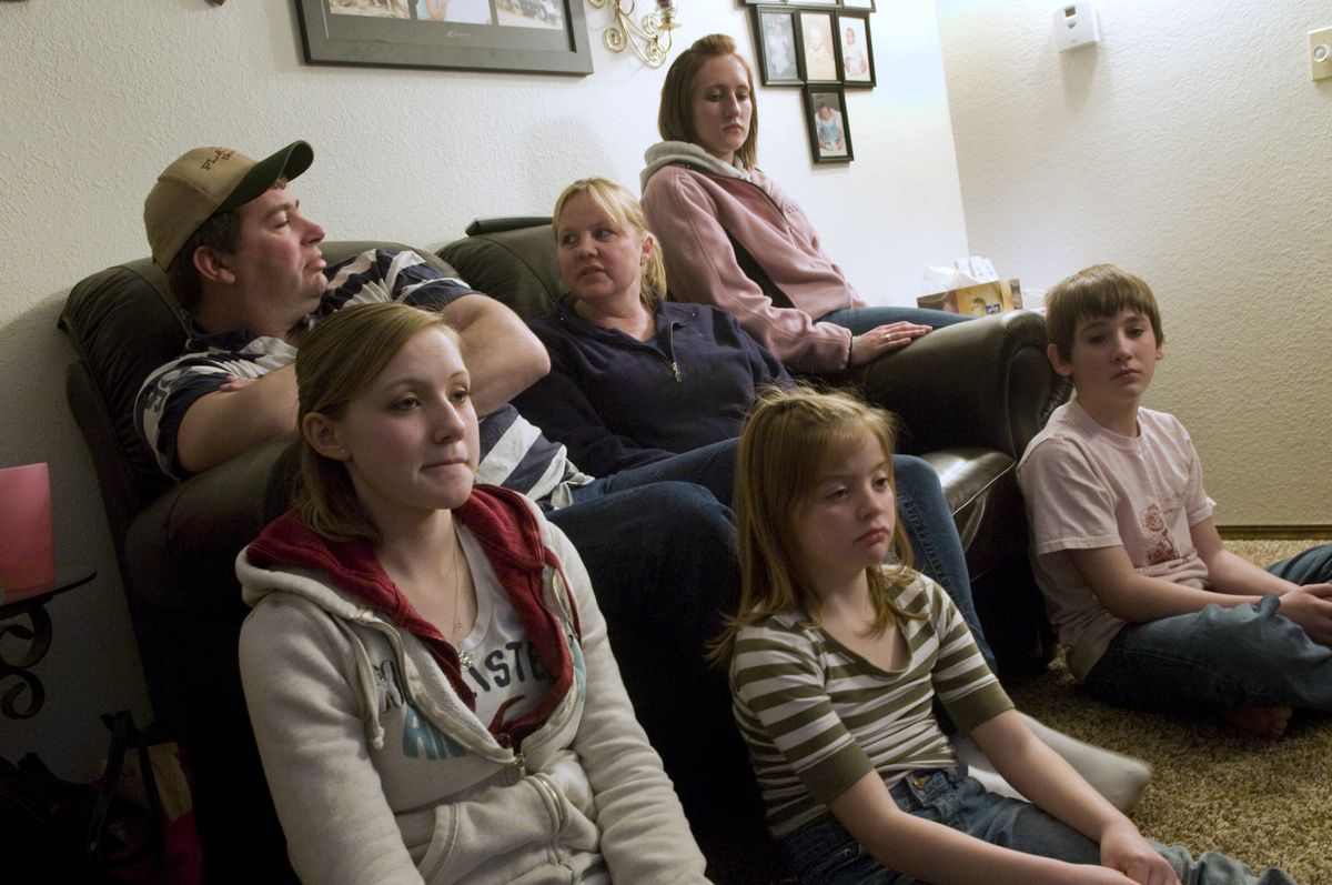 The Hammel family lost  daugther and sister Lorissa Green, 16, to a car accident on Highway 195 last month. They are now trying to turn their pain into something positive by working to make Highway 195 safer. Pictured on couch are, Jason and Debi Hammel and Kayla Green, 18, and in front, Alexis Green, 17, Hanne Hammel, 8, and Shane Hammel, 11.  (Colin Mulvany / The Spokesman-Review)