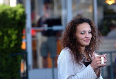 
Third-shift waitress Amber Deahn takes reporters' questions with her coffee Saturday morning outside Denny's. 
 (Jesse Tinsley / The Spokesman-Review)