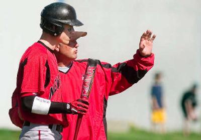 
Zach Green, one of seven seniors on the Newport High School baseball team, gets some instruction from coach Rusty Hargrove. 
 (Kathryn Stevens / The Spokesman-Review)