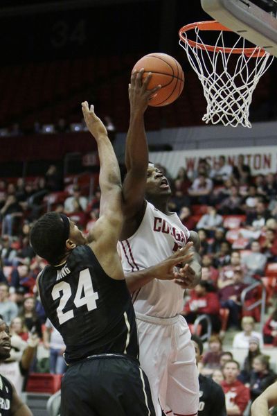 Washington State’s Ike Iroegbu, right, powered for 27 points against Colorado. (Young Kwak / Associated Press)