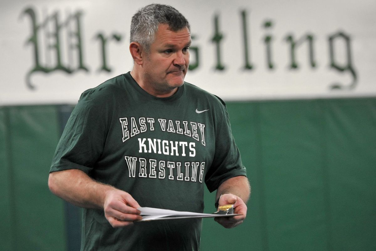 East Valley High school wrestling coach, Craig Hanson instructs his team during practice.