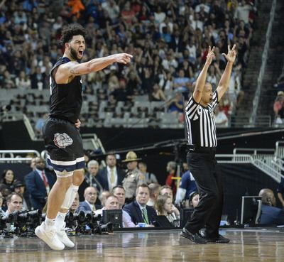 Gonzaga’s Josh Perkins celebrates after sinking a 3-pointers against North Carolina on Monday. (Dan Pelle / The Spokesman-Review)