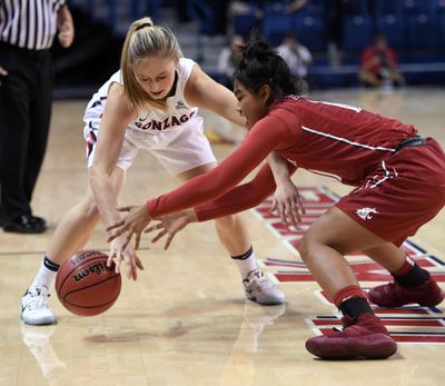 Washington State freshman guard Chanelle Molina, right, averaged 24.5 points last week in wins over UCLA and USC. (Colin Mulvany / The Spokesman-Review)
