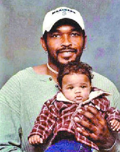 
Jerome Alford poses with his son, Darian, in 2003.  Alford died March 24 during an altercation with police.
 (Photo courtesy of Michelle Jakma / The Spokesman-Review)