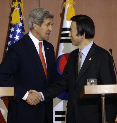 U.S. Secretary of State John Kerry shakes hands with South Korean Foreign Minister Yun Byung-se during a press conference in Seoul on Friday. (Associated Press)