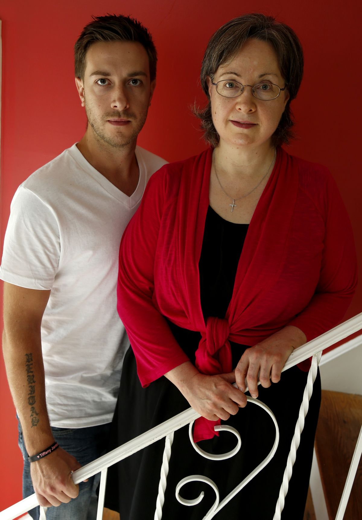 In this portrait taken Wednesday, Aug. 22, 2012, Germaine Maurer, left, and her son Jared Maurer, 28, pose for the Associated Press in their home in Piscataway, N.J. Germaine Maurer's other son, Ben Maurer, went missing when he was 17 in 2002. He was identified through advanced DNA technology and new federal funding through a program aimed at identifying bodies at New York's Hart Island, better known as potter's field. Already the project has identified about 50 of the 54 bodies that have been disinterred. (Julio Cortez / Associated Press)