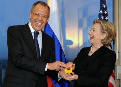 Secretary of State Hillary Rodham Clinton on Friday presents Russian Foreign Minister Sergei Lavrov with a mock “reset button” in a gesture designed to symbolize a break from the snarling relationship during the Bush administration. Lavrov needles Clinton by pointing out that due to a translation error the button was labeled not “reset” but “overcharge.”   (Associated Press / The Spokesman-Review)