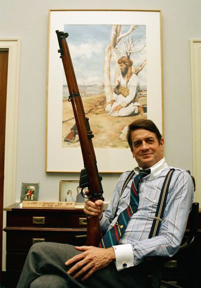 In this October 1988 photo, Rep. Charlie Wilson, D-Texas, holds a British Enfield rifle in his Capitol Hill office. Wilson, 76, died in Lufkin, Texas, Wednesday.  (File Associated Press)