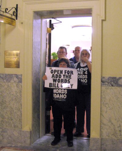 “Add the 4 Words” protesters block the entrance to the Idaho Legislature’s bill-drafting offices on Monday. The protest led to 25 arrests. (Betsy Z. Russell)