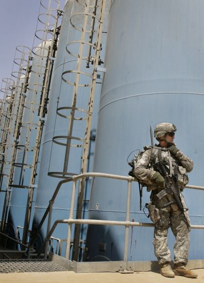 A U.S. soldier stands guard Saturday at the Sharkh Dijlah water treatment plant in Baghdad.  (Associated Press / The Spokesman-Review)