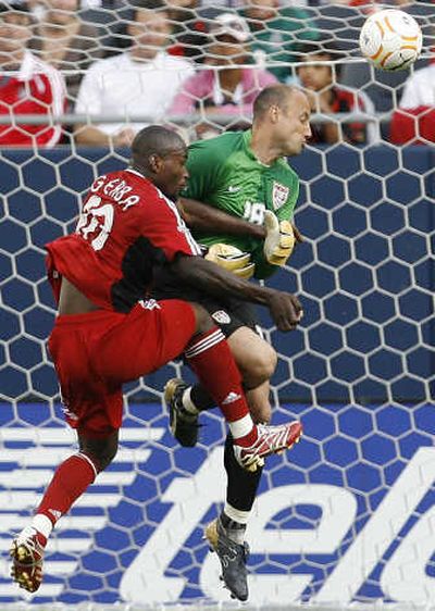 
U.S. goalkeeper Kasey Keller, right, blocks a shot by Canada's Ali Gerba. Associated Press
 (Associated Press / The Spokesman-Review)