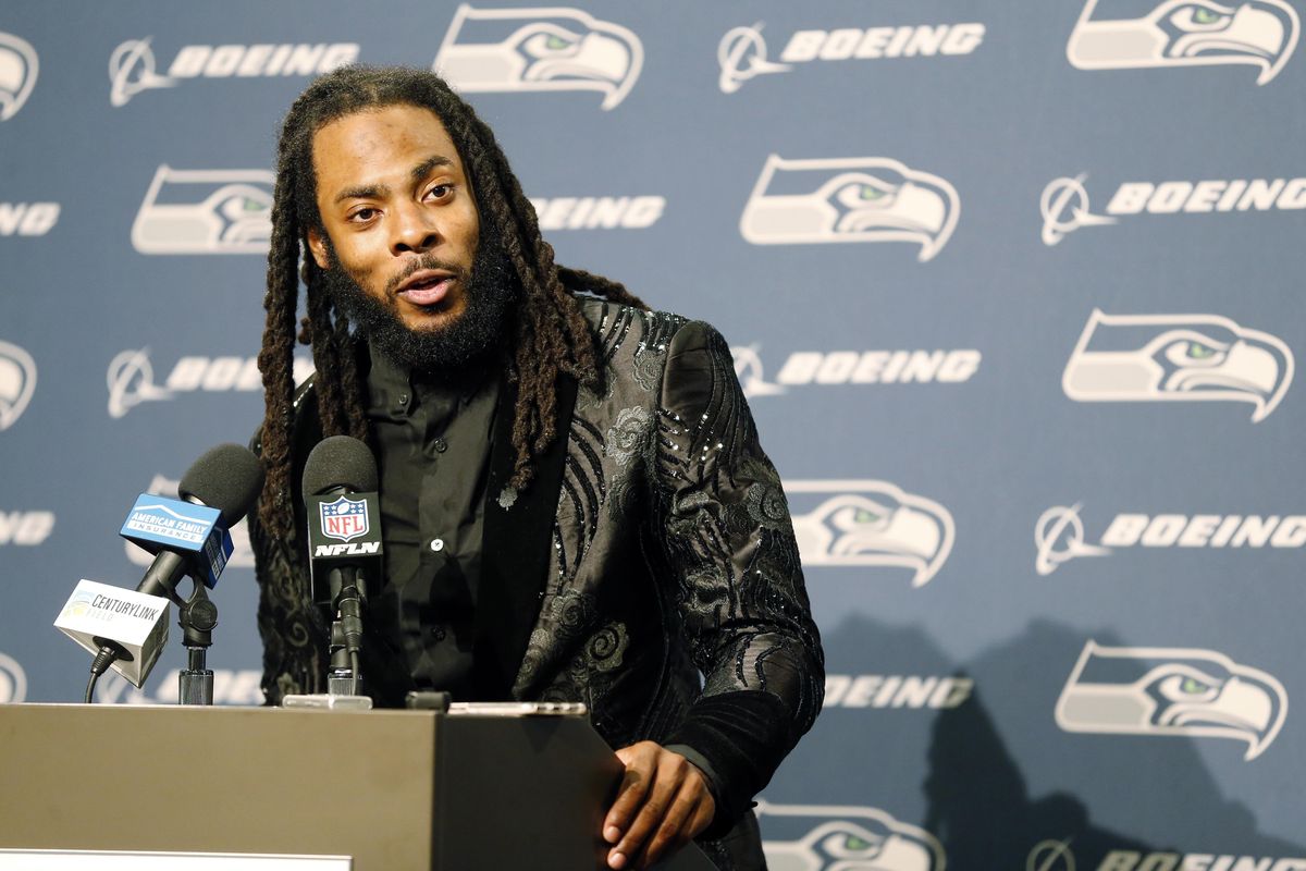 In this Oct. 29, 2017, file photo, former Seattle Seahawks cornerback Richard Sherman talks to reporters during a postgame press conference following an NFL game against the Houston Texans,in Seattle. (Stephen Brashear / AP)