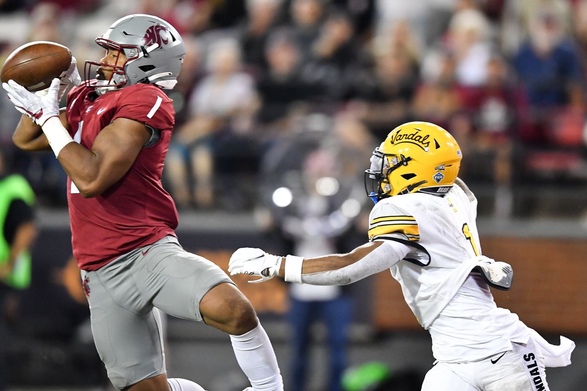 Washington State Cougars linebacker Daiyan Henley (1) intercepts a pass intended for Idaho Vandals wide receiver Jermaine Jackson (1) in the final moments of the second half of a college football game on Saturday, Sept. 3, 2022, at Martin Stadium in Pullman, Wash. WSU won the game 24-17.  (Tyler Tjomsland/The Spokesman-Review)