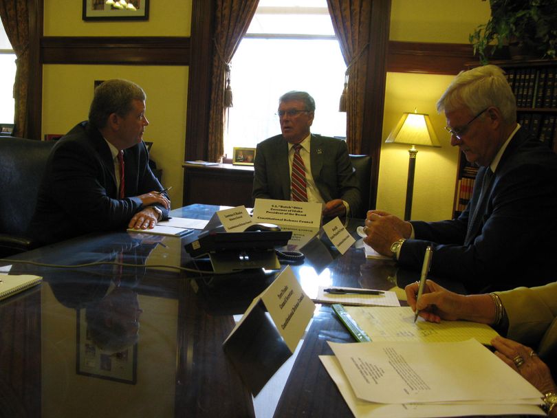 Idaho Attorney General Lawrence Wasden, left, Gov. Butch Otter, center, and Senate President Pro-Tem Brent Hill, right, meet as the Constitutional Defense Council on Wednesday. (Betsy Z. Russell)
