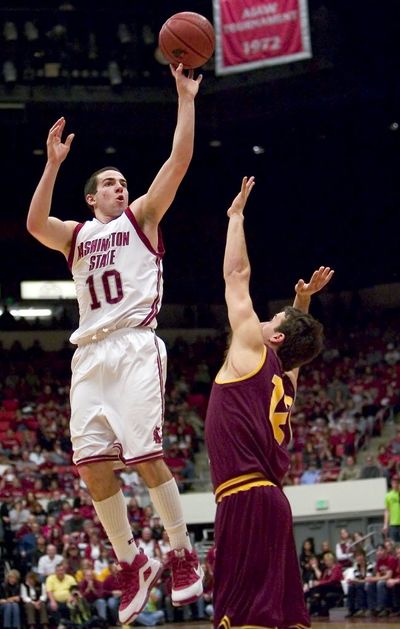Washington State guard Taylor Rochestie shoots over Arizona State guard Derek Glasser during the first half of an NCAA college basketball game today at Jack Friel Court in Pullman. (The Spokesman-Review)