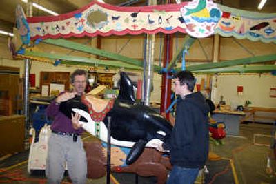 
Carousel maker Bill Dentzel and Port Townsend High School junior Phil Allen position a wooden orca that is part of a carousel built by students in Port Townsend, Wash., recently. The carousel  will be donated to Waveland, Miss. Associated Press
 (Associated Press / The Spokesman-Review)