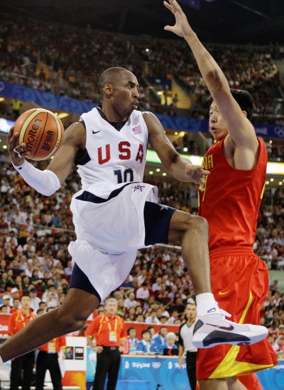 Team USA’s Kobe Bryant, shown driving to the basket against China’s Wang Zhizhi, put up 13 points in the Americans’ 101-70 victory over the Chinese on Sunday.  (Associated Press / The Spokesman-Review)