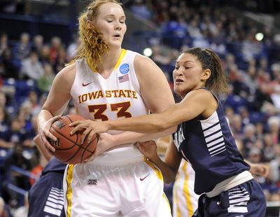 Gonzaga guard Jazmine Redmon (34) reaches around Iowa State forward Chelsea Poppens (33) during the first half of the first round of the 2013 NCAA Division I Women's Basketball Championship Tournament on Saturday at McCarthey Athletic Center.  (Tyler Tjomsland)
