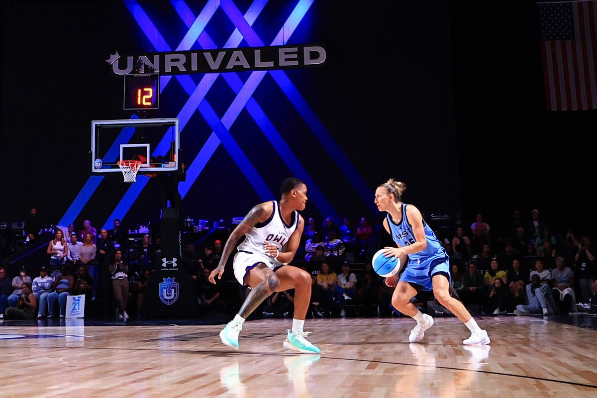 Courtney Vandersloot of the Mist controls the ball ahead of Courtney Williams of the Lunar Owls during the second half at The Mediapro Studio on Jan. 17 in Medley, Fla.  (Getty Images)