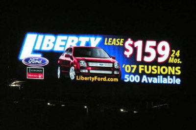 
An auto advertisement is shown on a digital billboard in Cleveland. Digital billboards resemble ballpark jumbo video displays but scroll through several static ads each minute. 
 (Associated Press / The Spokesman-Review)