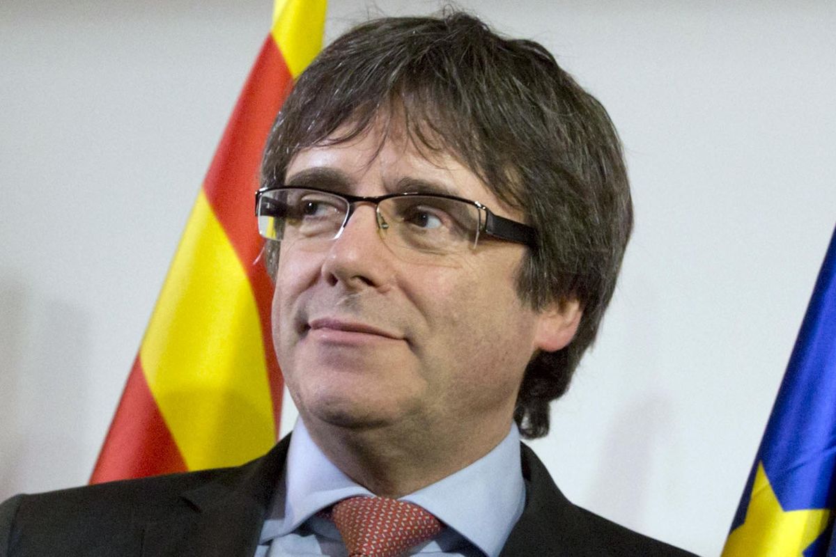 In this Dec. 21, 2017  photo ousted Catalan leader Carles Puigdemont takes the podium at a gathering to watch the election results for Spain