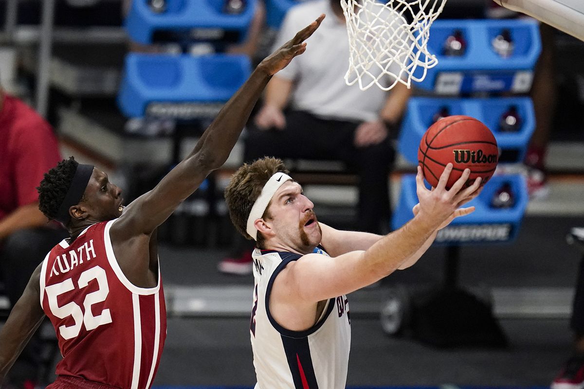 Gonzaga forward Drew Timme, right, shoots in front of Oklahoma forward Kur Kuath in the first half of a second-round game in the NCAA men’s college basketball tournament at Hinkle Fieldhouse in Indianapolis on Monday.  (Michael Conroy/Associated Press)
