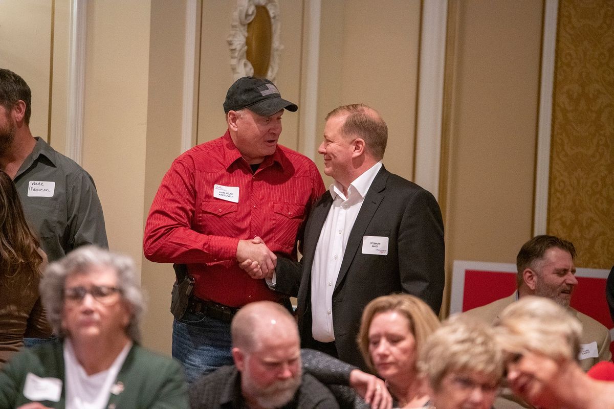 Incumbent Spokane Sheriff Ozzie Knezovich, left, shakes hands with sheriff-elect John Nowels, right, Tuesday, Nov. 8, 2022 at the Davenport Hotel where Republicans were celebrating election night.  (Jesse Tinsley/THE SPOKESMAN-REVI)