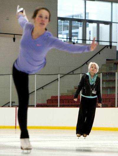 Karin Künzle-Watson, a figure skating coach. watches skater Emily Korotish during a practice on Jan. 16 at EWU’s recreation center skating rink in Cheney. (Tyler Tjomsland)