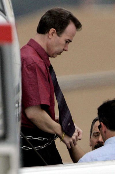 
John Mark Karr is escorted from a plane in Broomfield, Colo., on Thursday. 
 (Associated Press / The Spokesman-Review)